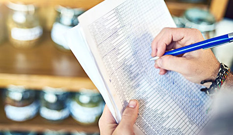 Manager working on a checklist