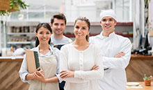 Restaurant staff smiling and posing for the camera