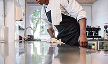 Chef cleaning up his kitchen