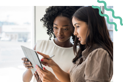 Two women looking at an iPad together