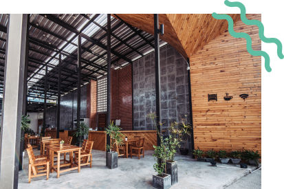 A restaurant interior designed with a outdoorsy feel.