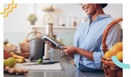 A customer putting their card into a payment terminal to pay.